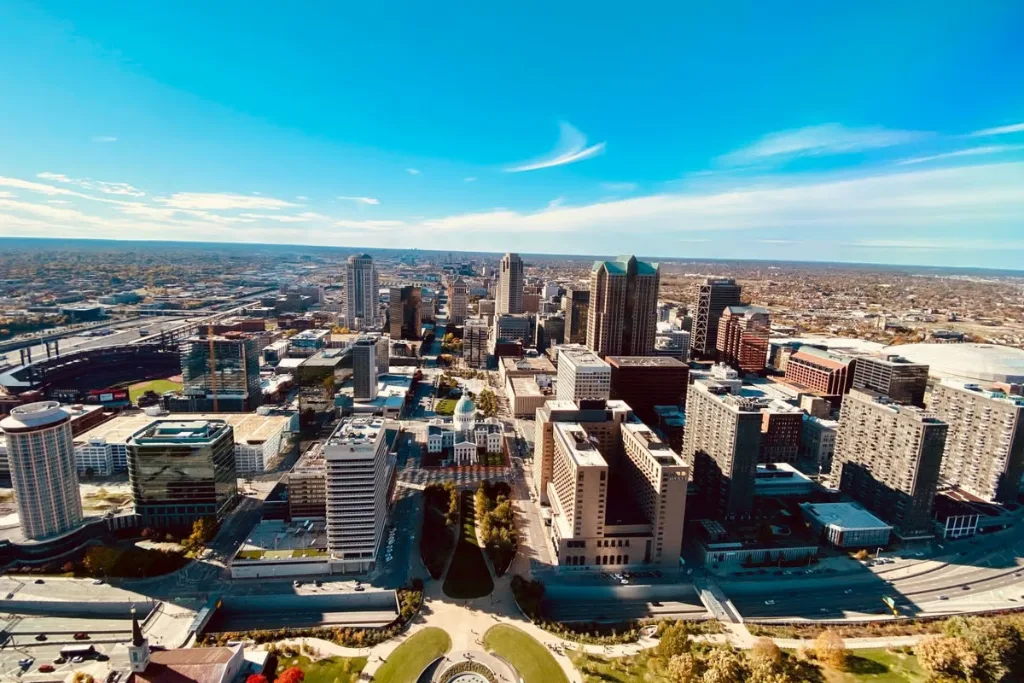 Aerial view of a downtown skyline under a blue sky