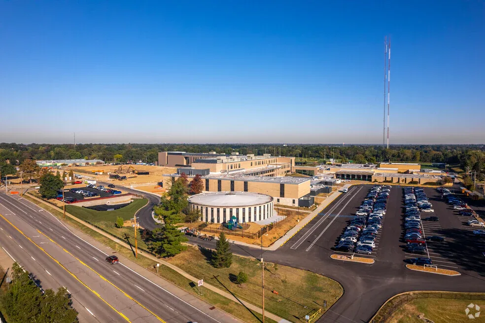 Aerial view of commercial buildings and a highway in Fenton