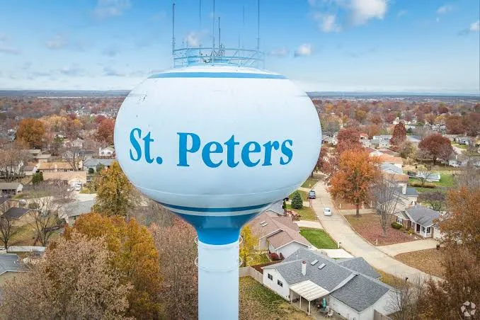 St. Peters water tower above autumn trees and homes