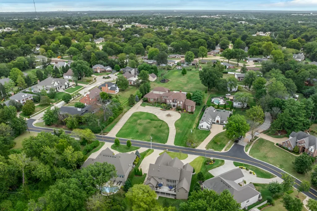 Aerial view of tree-lined homes and winding roads in Sunset Hills